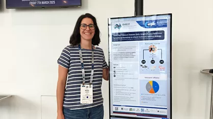 Maria Costa poses with her poster at ISVEE17